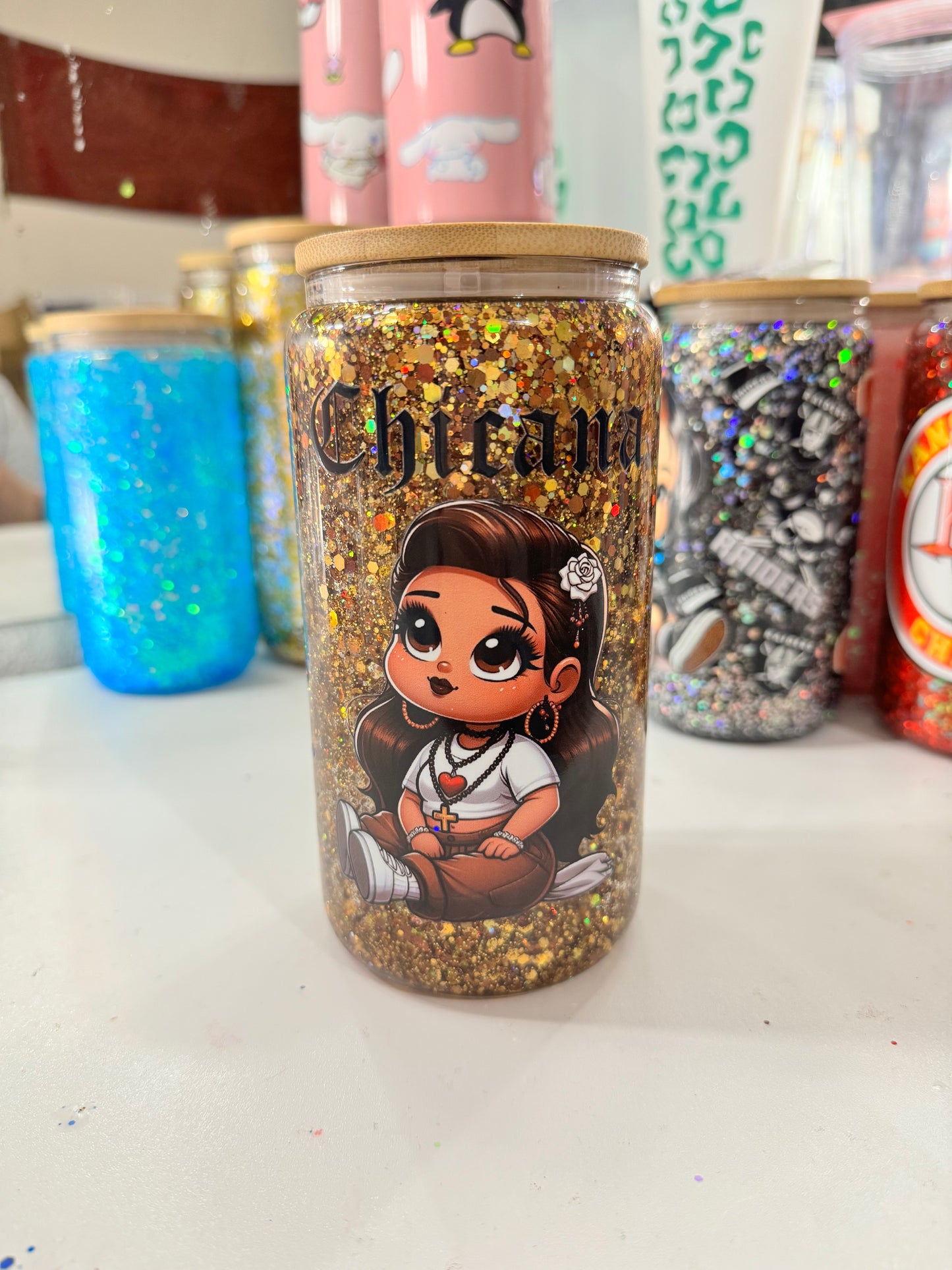 baby chicana snowglobe